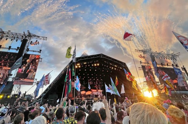 Glastonbury Festival's Pyramid Stage seen from crowd using fisheye lens