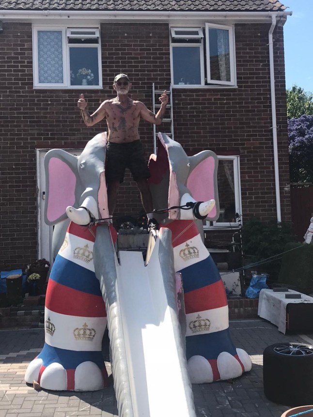 Trevor Robinson atop the eight foot high elephant slide outside his home. Release date June 19 2025. A fuming pensioner says he will "pay any money" to get his beloved 20ft-long elephant slide back - after a council confiscated it. The decades-old fibreglass play equipment was taken away from Trevor Robinson's home after complaints from neighbours, he claims. The 71-year-old had the 8ft tall slide delivered after spotting sub-contractors preparing to remove it from a nearby leisure park in Gillingham, Kent two months ago. Trevor, who lives in the suburb of Twydall, had initially planned to create a pond in his back garden for the slide - named Ellie - so children in the neighbourhood could use it.