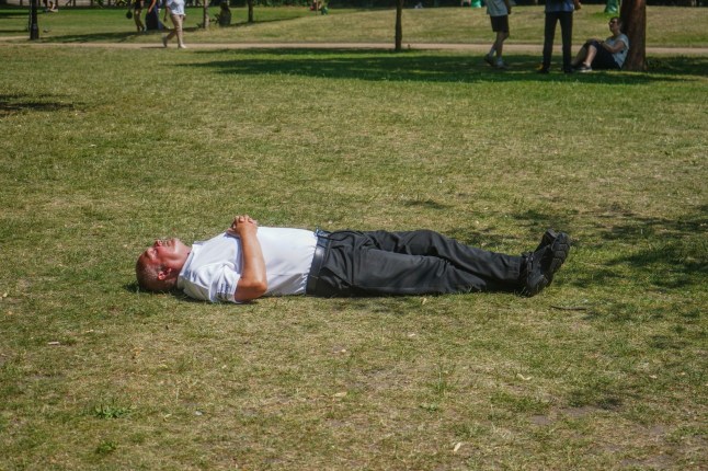 Man lying on grass.