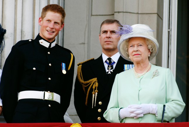 LONDON - JULY 10: Prince Harry wearing his Sandhurst army uniform, Prince Andrew the Duke of York and HM Queen Elizabeth ll watch the flypast over The Mall of British and US World War II aircraft from the Buckingham Palace balcony on National Commemoration Day July 10, 2005 in London. Poppies were dropped from the Lancaster Bomber of the Battle Of Britain Memorial Flight as part of the flypast. (Photo by Anwar Hussein/Getty Images)