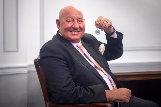 Former heavyweight boxer Ronnie Russell poses with the George Medal he was awarded for saving Princess Anne from a kidnap attempt in 1974, ahead of it being auctioned at Dix Noonan Webb in London.